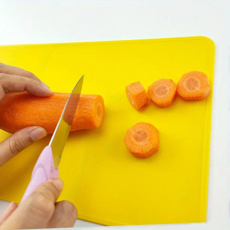 Colorful plastic cutting board for fruit and vegetable chopping, available in multiple colours – Purease